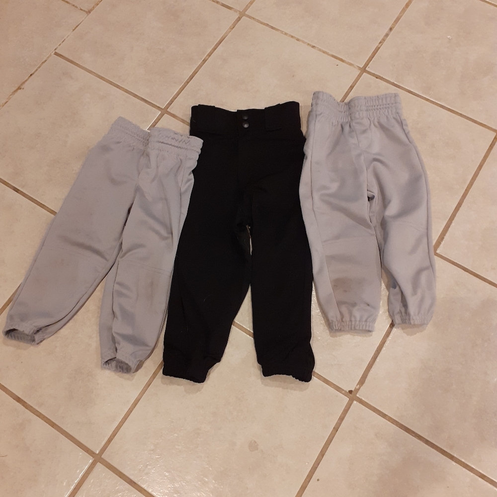 2 pairs of 2xs baseball pants 1 pair of xs